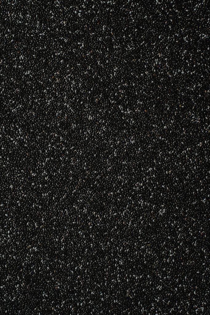 Close-up of textured black chia seeds, perfect for healthy diet concepts.